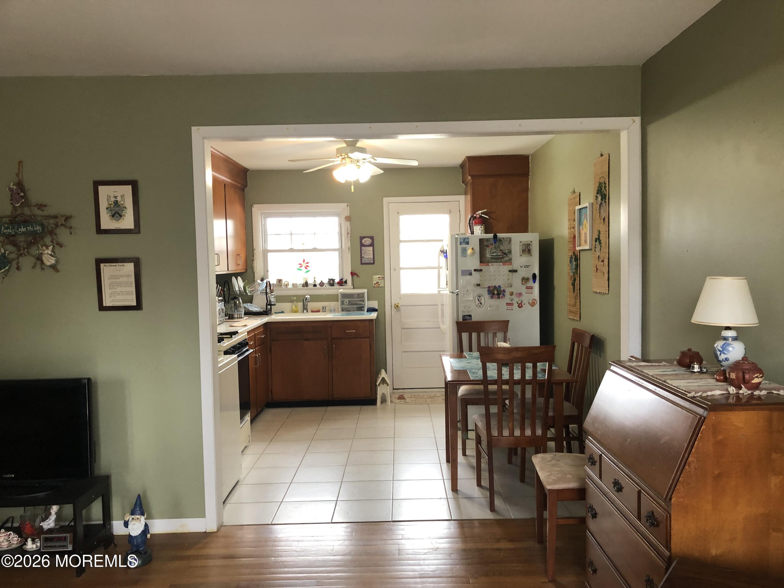1122 Pine Bluff Avenue Point Pleasant, NJ 08742 - Photo 6 of 10 a view of a dining room with furniture and wooden floor