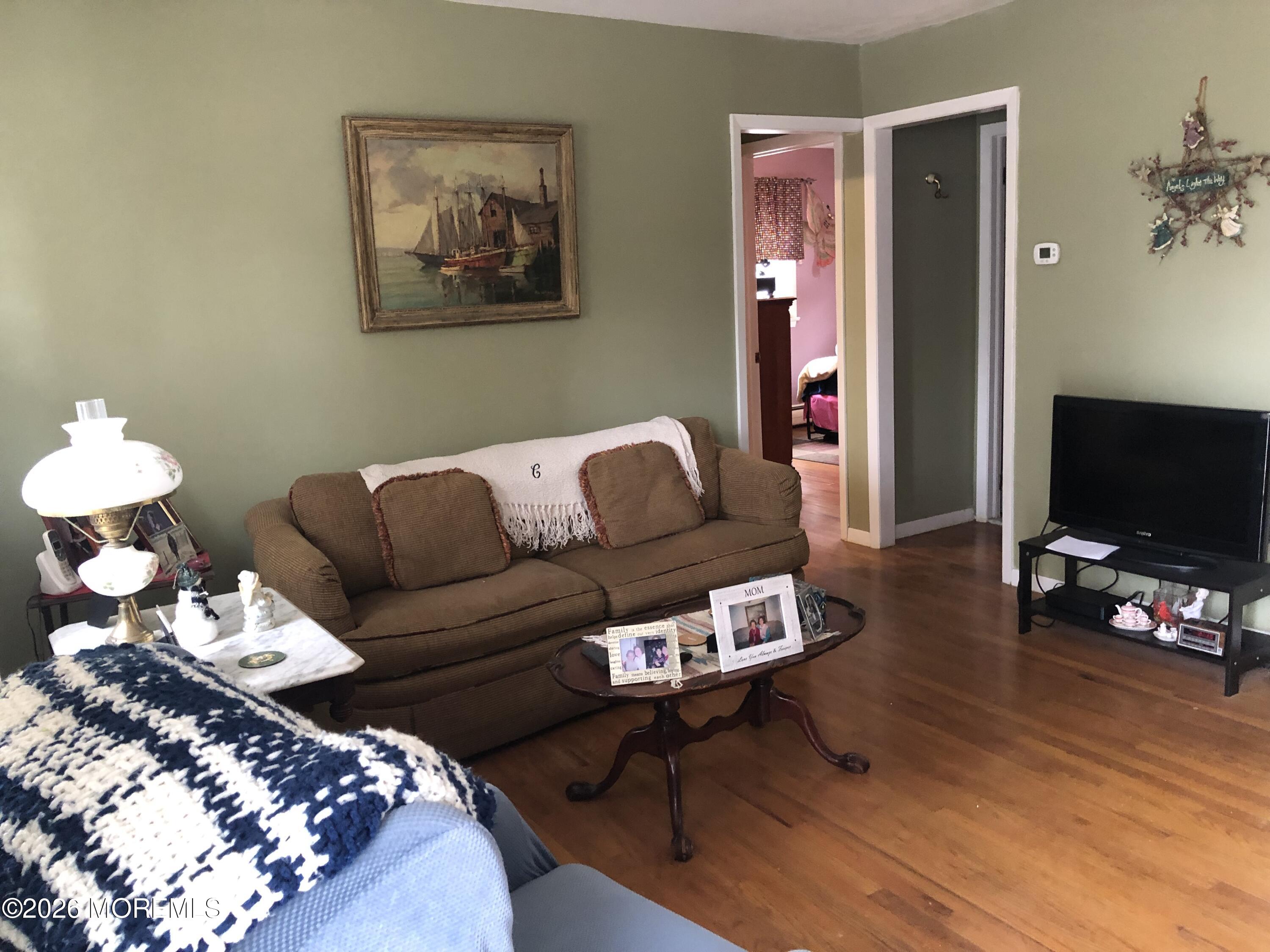 1122 Pine Bluff Avenue Point Pleasant, NJ 08742 - Photo 7 of 10 a living room with furniture and wooden floor