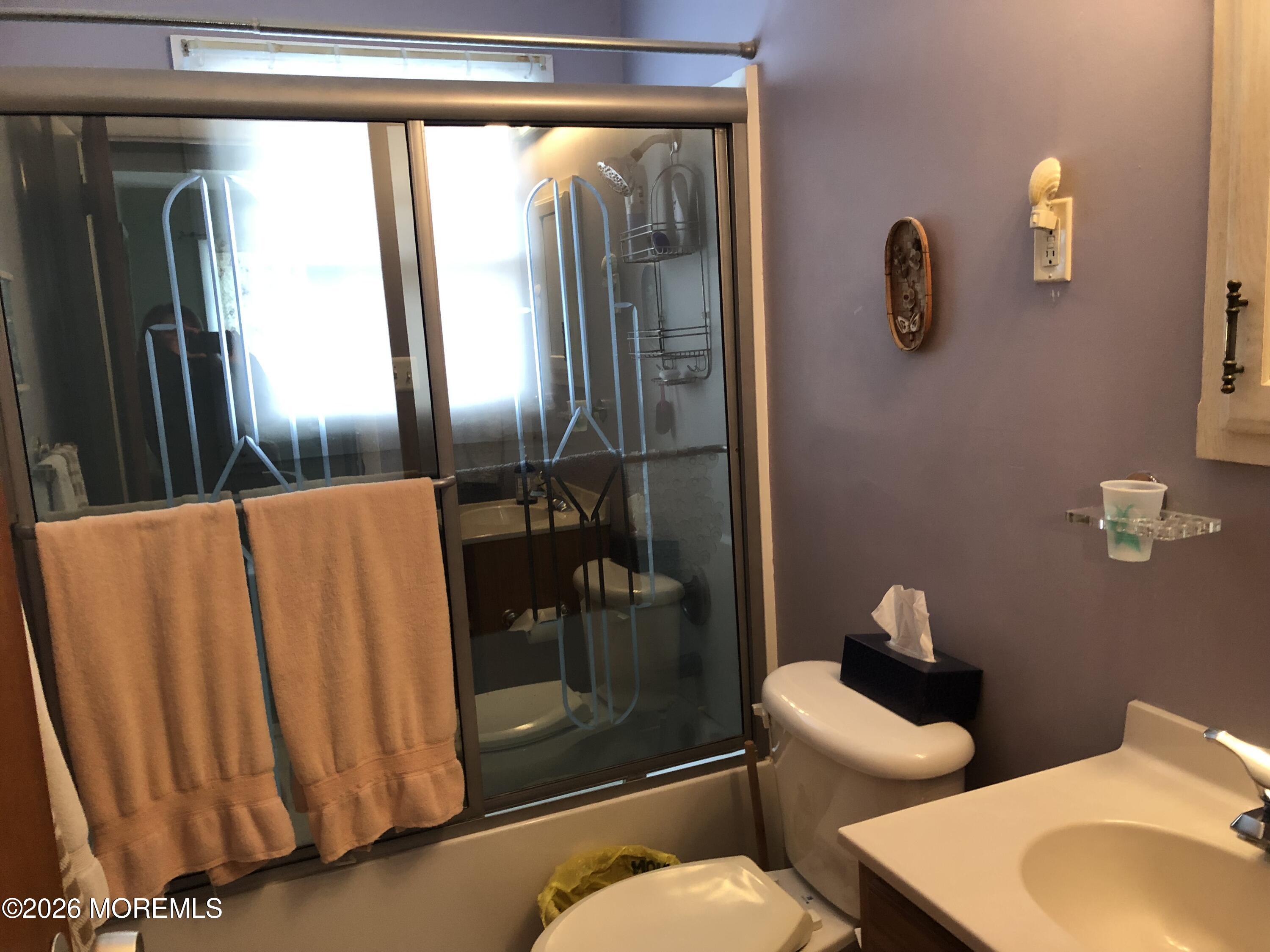 1122 Pine Bluff Avenue Point Pleasant, NJ 08742 - Photo 8 of 10 a bathroom with a toilet sink and shower