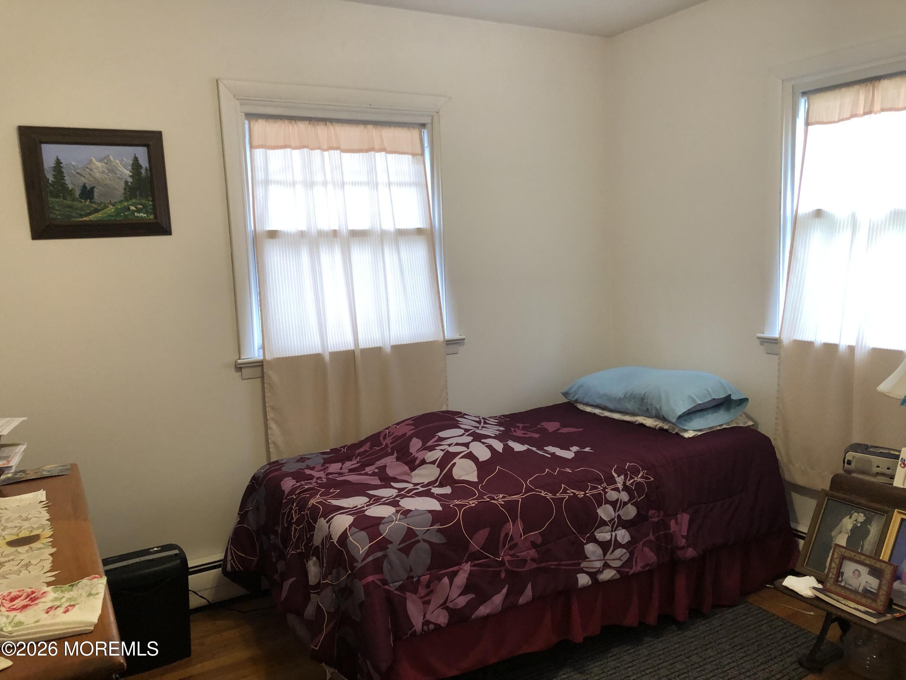 1122 Pine Bluff Avenue Point Pleasant, NJ 08742 - Photo 10 of 10 a bedroom with a bed and a window