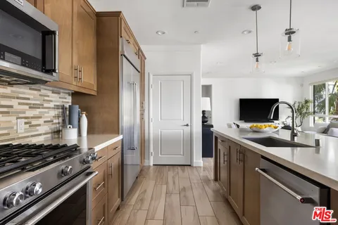 a kitchen that has a stove and a microwave