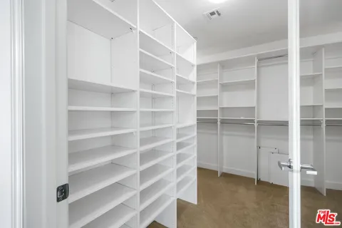 a view of an empty walk in closet