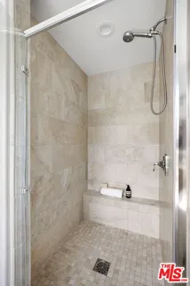 a bathroom with a shower and a shower