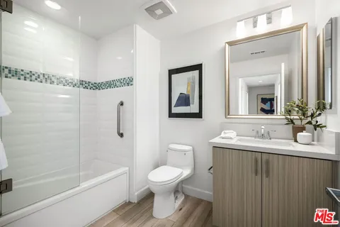 a bathroom with a toilet a sink and a bathtub