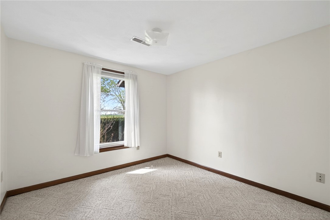 7988 McCool Road Greenville, OH 45331 - Photo 15 of 50 This bright room features a window overlooking lush greenery, offering a peaceful retreat.