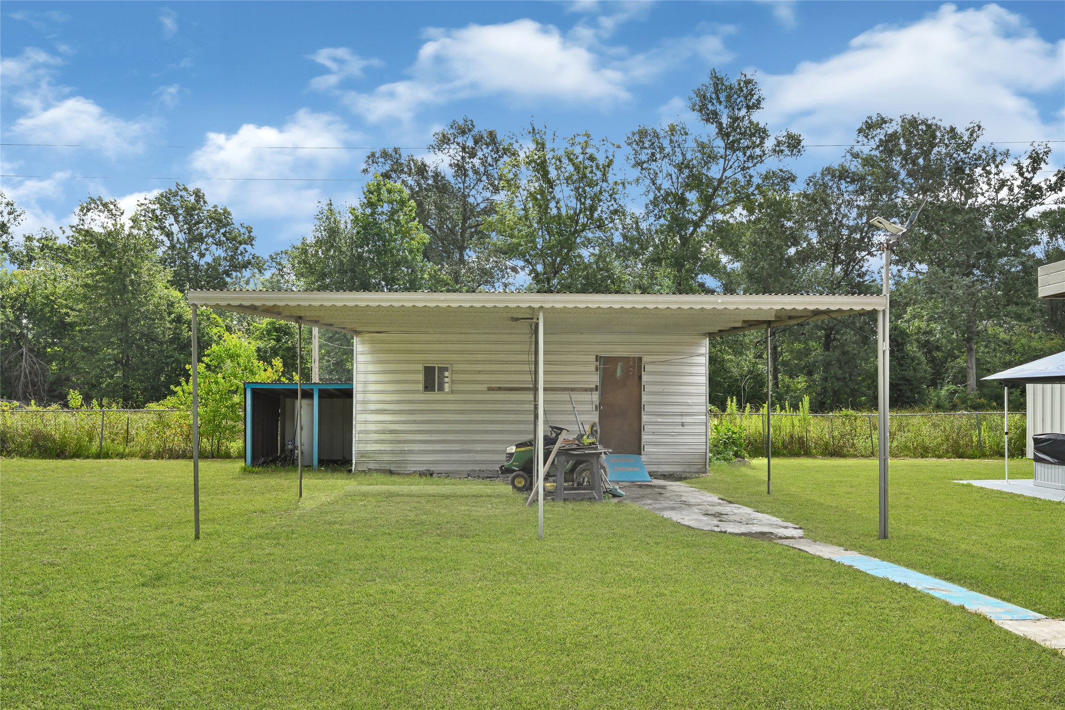 20135 Timber Line Lane New Caney, TX 77357 - Photo 24 of 30 a view of a backyard with a slide