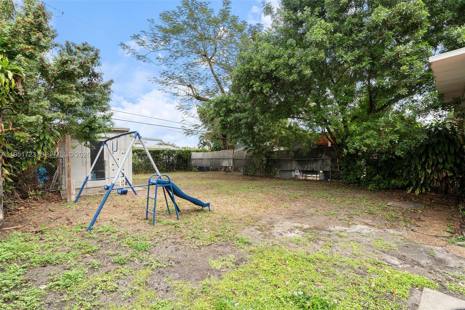 9601-9603 Southwest 36th Street Miami, FL 33165 - Photo 14 of 45 a view of outdoor space with playground and green space