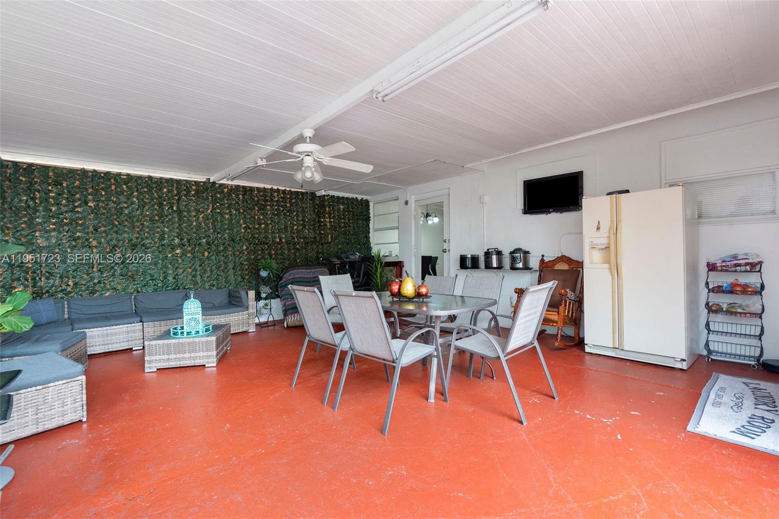 9601-9603 Southwest 36th Street Miami, FL 33165 - Photo 16 of 45 a dining room with furniture and a floor to ceiling window
