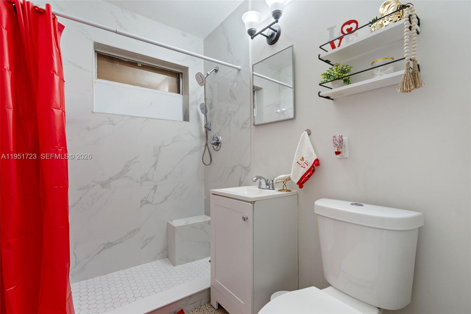 9601-9603 Southwest 36th Street Miami, FL 33165 - Photo 19 of 45 a white toilet sitting next to a bath tub and a shower