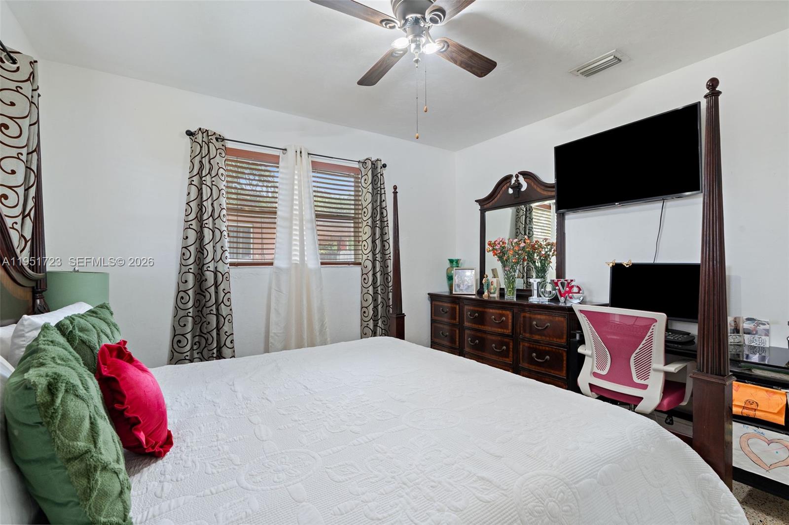 9601-9603 Southwest 36th Street Miami, FL 33165 - Photo 22 of 45 a bedroom with a bed and a flat screen tv