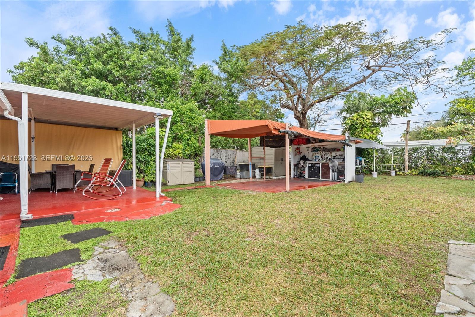 9601-9603 Southwest 36th Street Miami, FL 33165 - Photo 26 of 45 a view of a swimming pool with a patio
