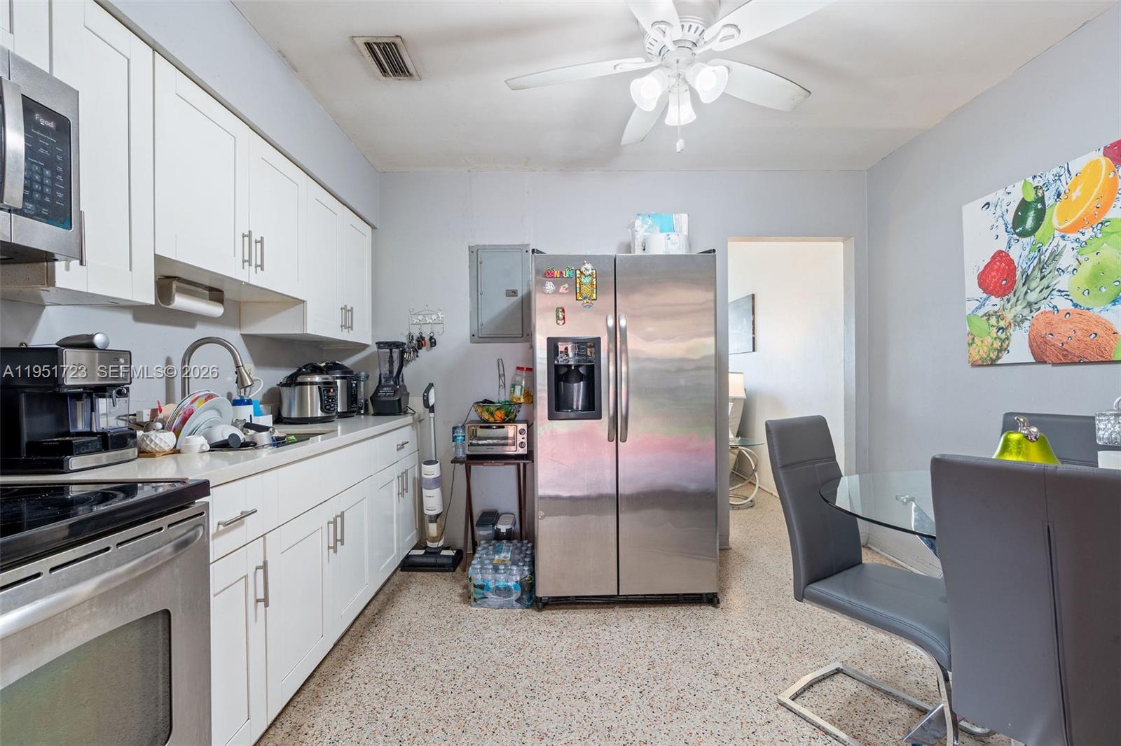 9601-9603 Southwest 36th Street Miami, FL 33165 - Photo 27 of 45 a kitchen with cabinets a sink and appliances