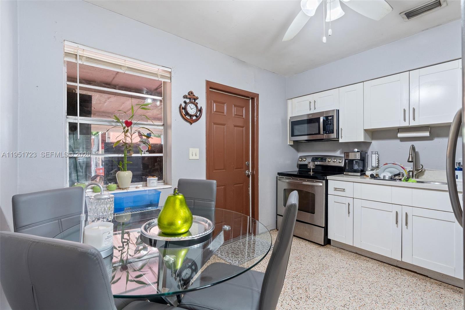9601-9603 Southwest 36th Street Miami, FL 33165 - Photo 30 of 45 a kitchen with stainless steel appliances a stove a sink and a refrigerator