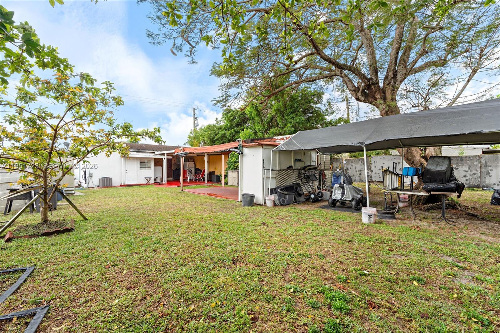 9601-9603 Southwest 36th Street Miami, FL 33165 - Photo 39 of 45 a view of a house with a yard patio and sitting area