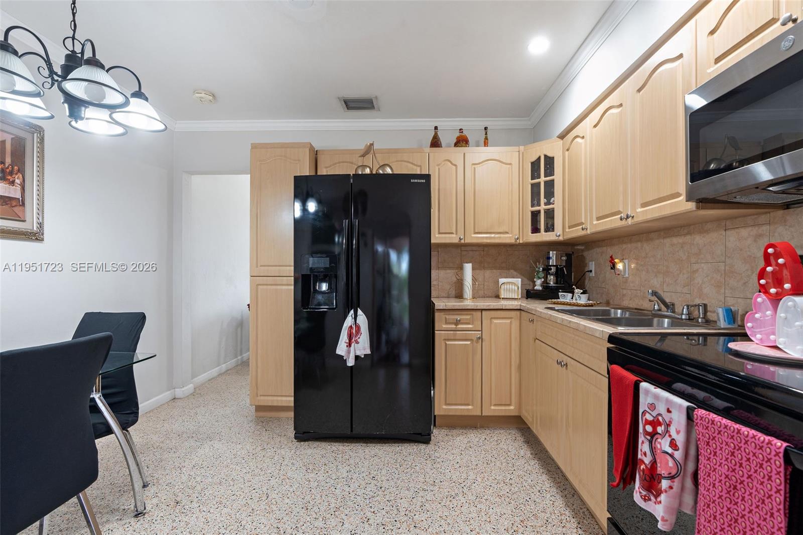 9601-9603 Southwest 36th Street Miami, FL 33165 - Photo 4 of 45 a kitchen with stainless steel appliances granite countertop a refrigerator a stove top oven a sink and dishwasher