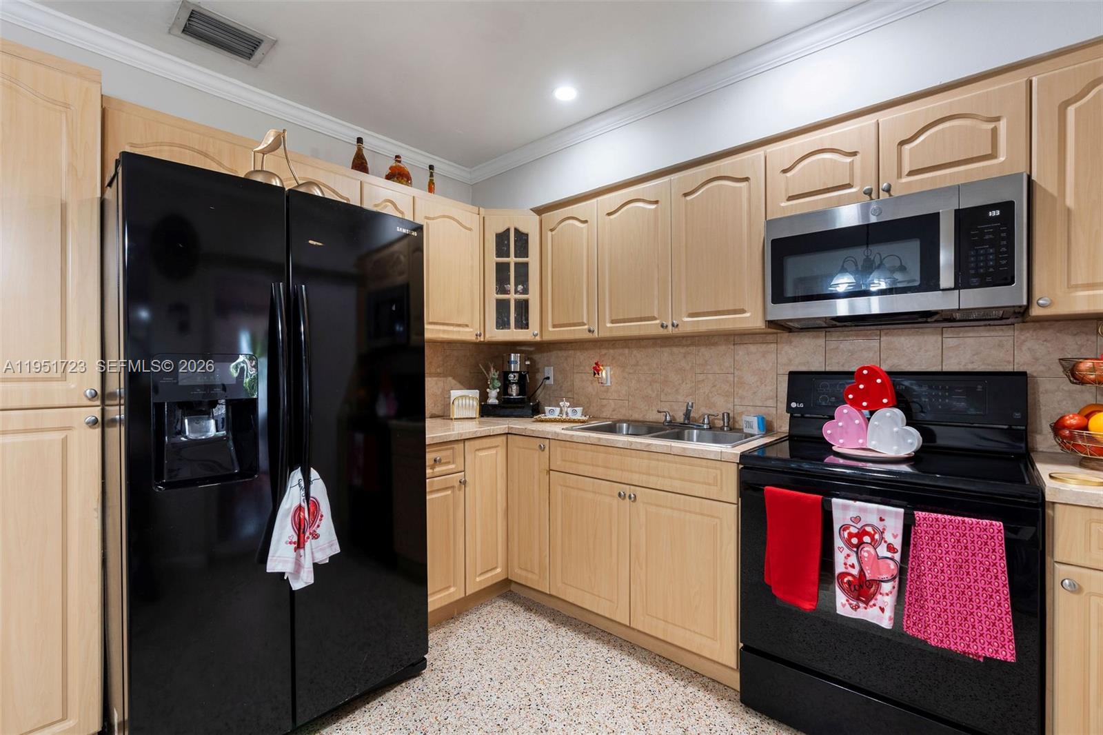 9601-9603 Southwest 36th Street Miami, FL 33165 - Photo 5 of 45 a kitchen with stainless steel appliances granite countertop a stove and cabinets