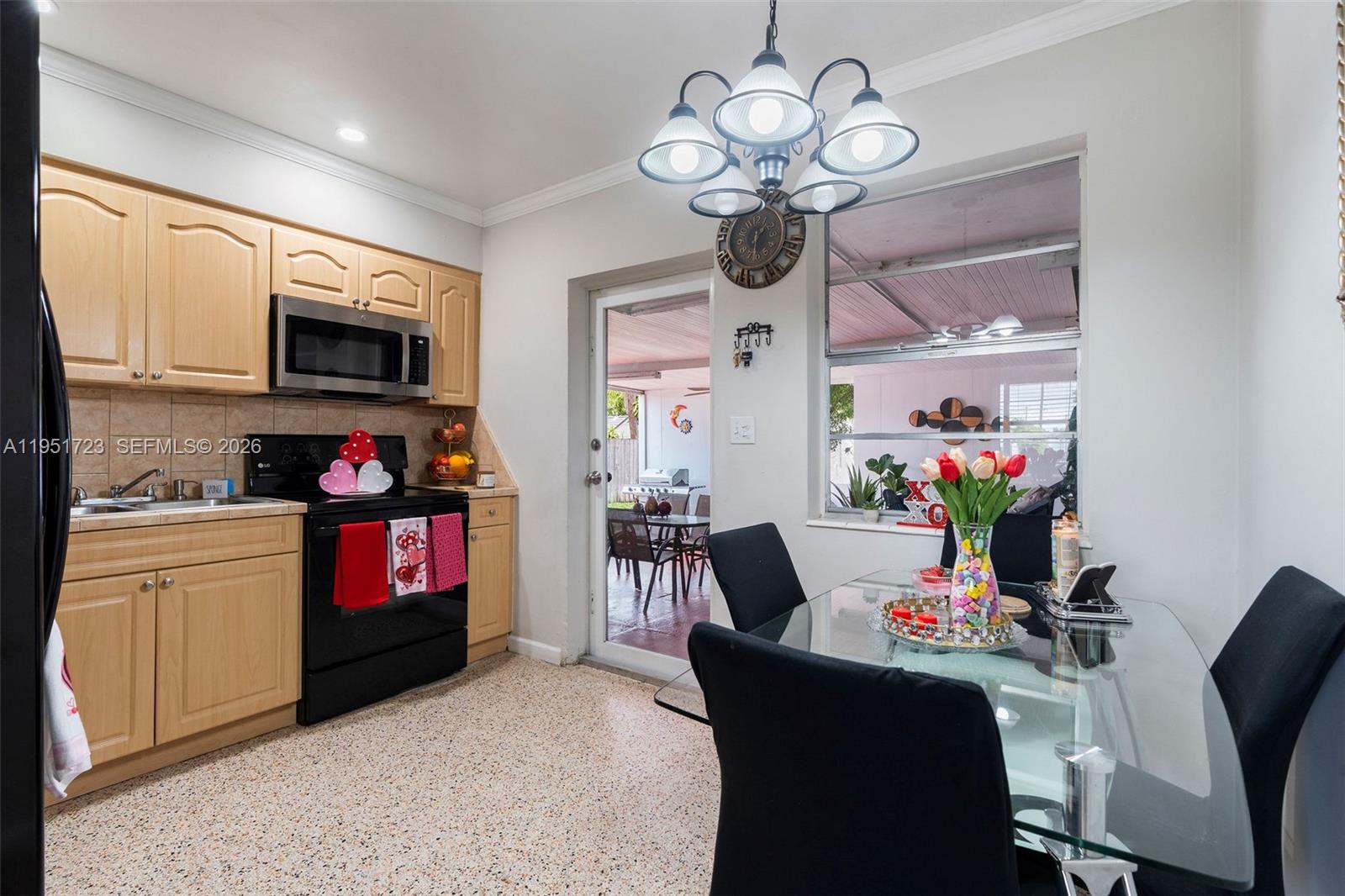 9601-9603 Southwest 36th Street Miami, FL 33165 - Photo 6 of 45 a living room with fireplace furniture and a kitchen view