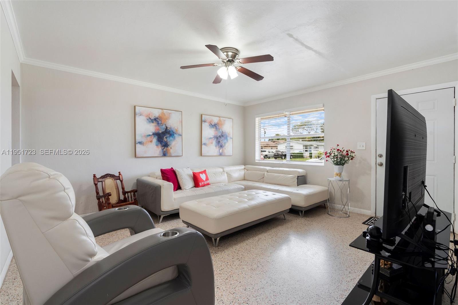 9601-9603 Southwest 36th Street Miami, FL 33165 - Photo 9 of 45 a living room with furniture and a flat screen tv