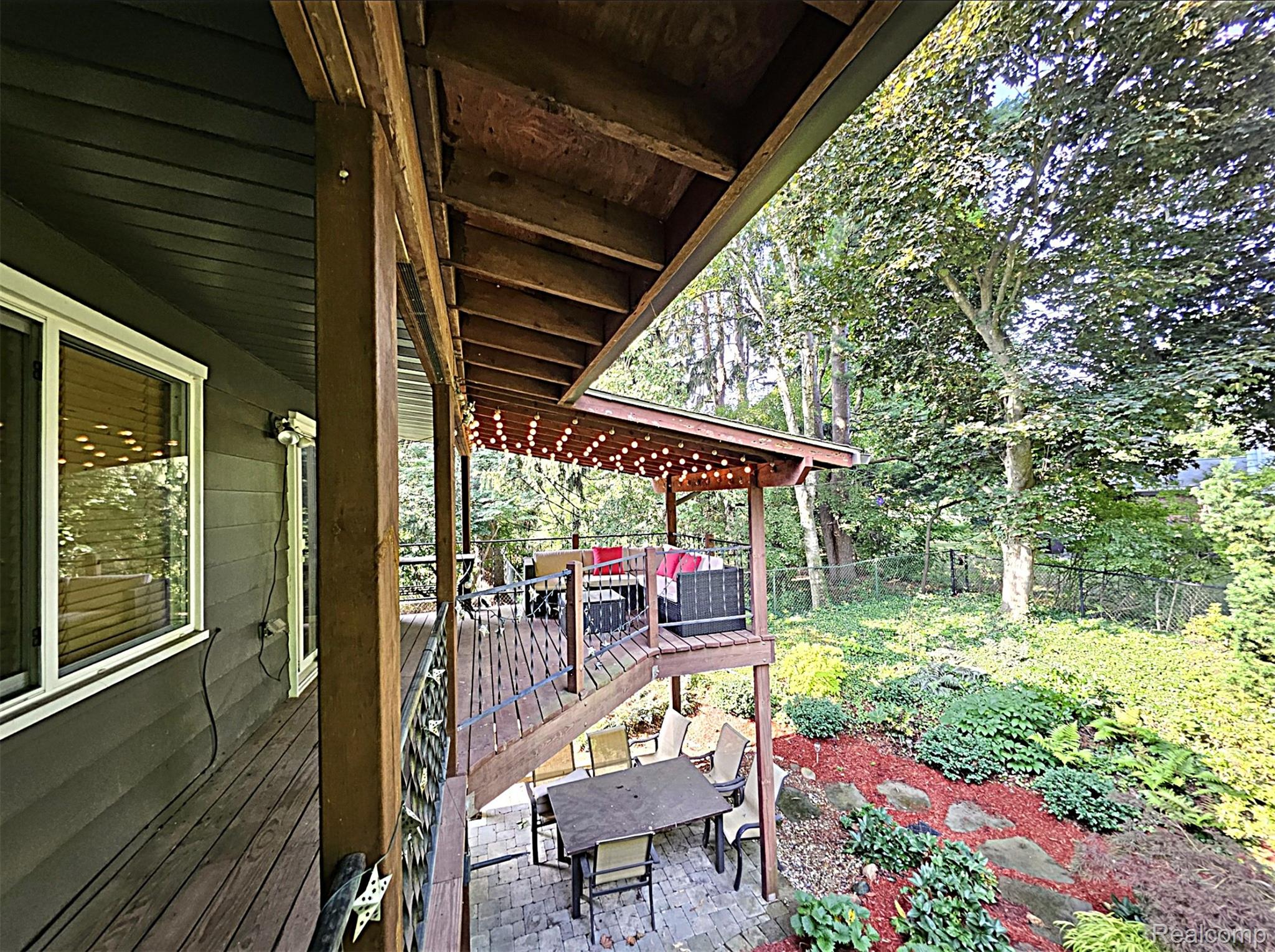 7120 Pebblecreek Road West Bloomfield, MI 48322 - Photo 8 of 31 Multi-level outdoor living space featuring a wood deck, covered patio, and landscaped terraced garden