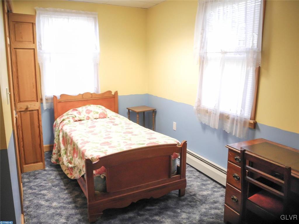 101 East Ruddle Street Coaldale, PA 18218 - Photo 14 of 22 a bedroom with a bed and a window