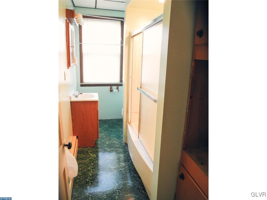 101 East Ruddle Street Coaldale, PA 18218 - Photo 16 of 22 a view of a bathroom with a sink and a mirror