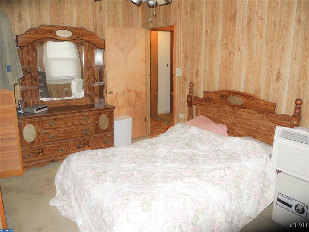 101 East Ruddle Street Coaldale, PA 18218 - Photo 17 of 22 a bedroom with a bed and a mirror