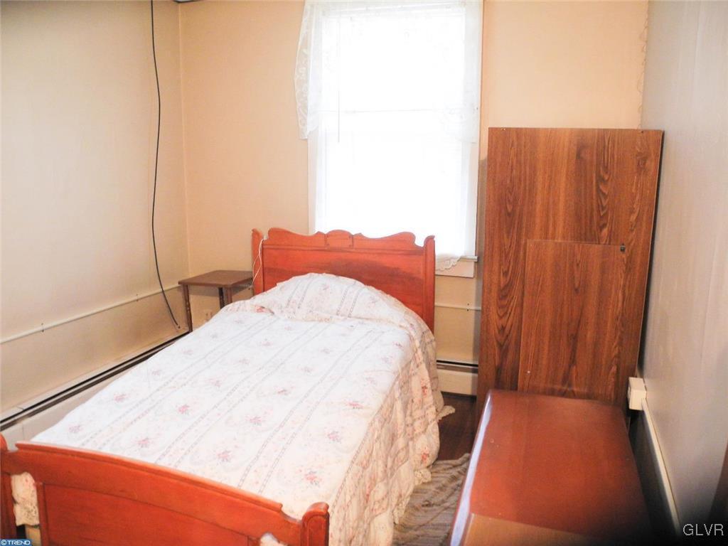 101 East Ruddle Street Coaldale, PA 18218 - Photo 19 of 22 a bedroom with a bed and a night stand