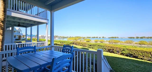 a view of a balcony with lake view and wooden floor