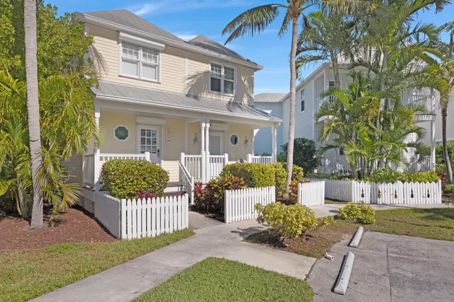 a view of a house with a yard and a garden