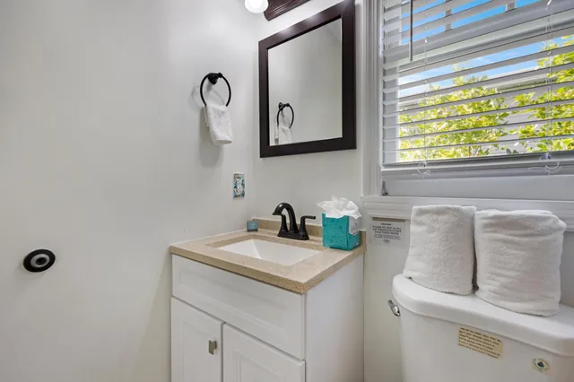 a room with a bench and cabinets