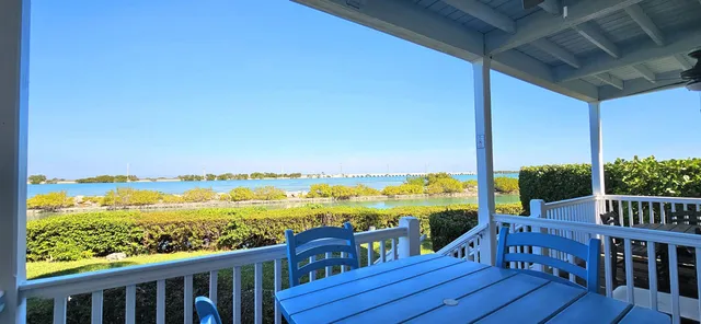 a front view of a house with a lake view