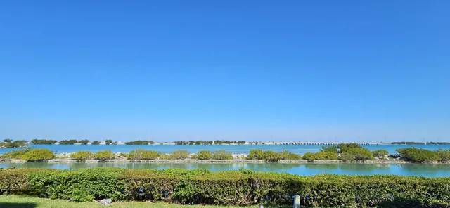 a bedroom with furniture and a large window
