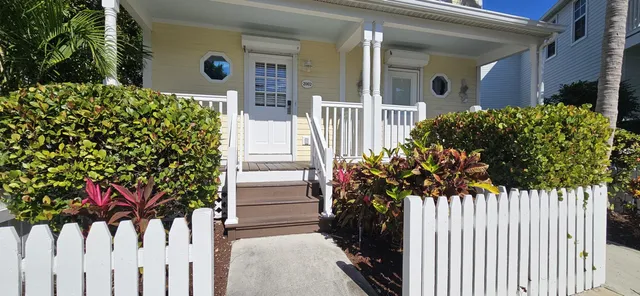 a flower plants in front of a house