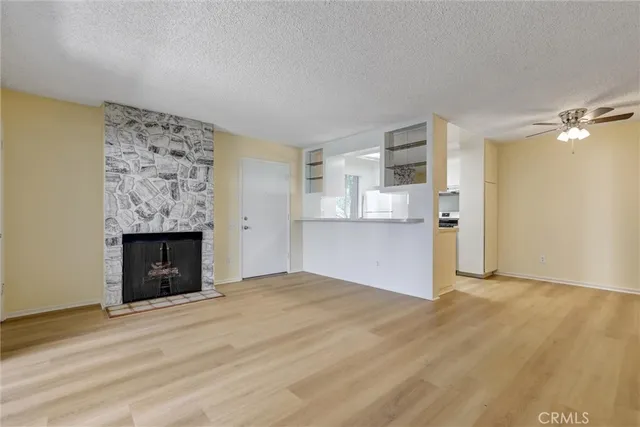 an empty room with a kitchen and a sink
