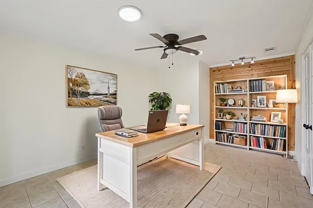 a workspace with furniture and window