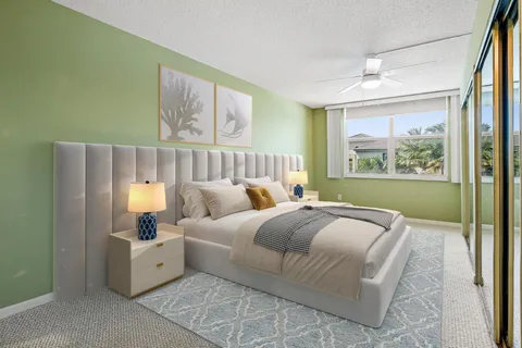 a bed room with a bed and a painting on the wall