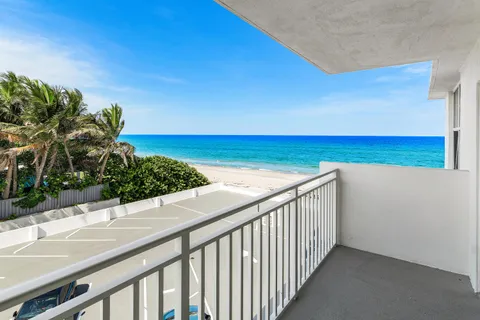 a view of balcony with wooden floor