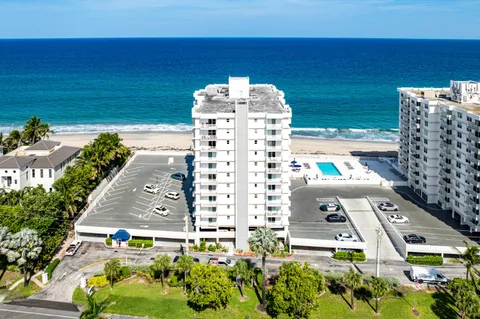 a view of a large building with a yard
