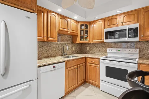 a kitchen with a stove microwave and cabinets