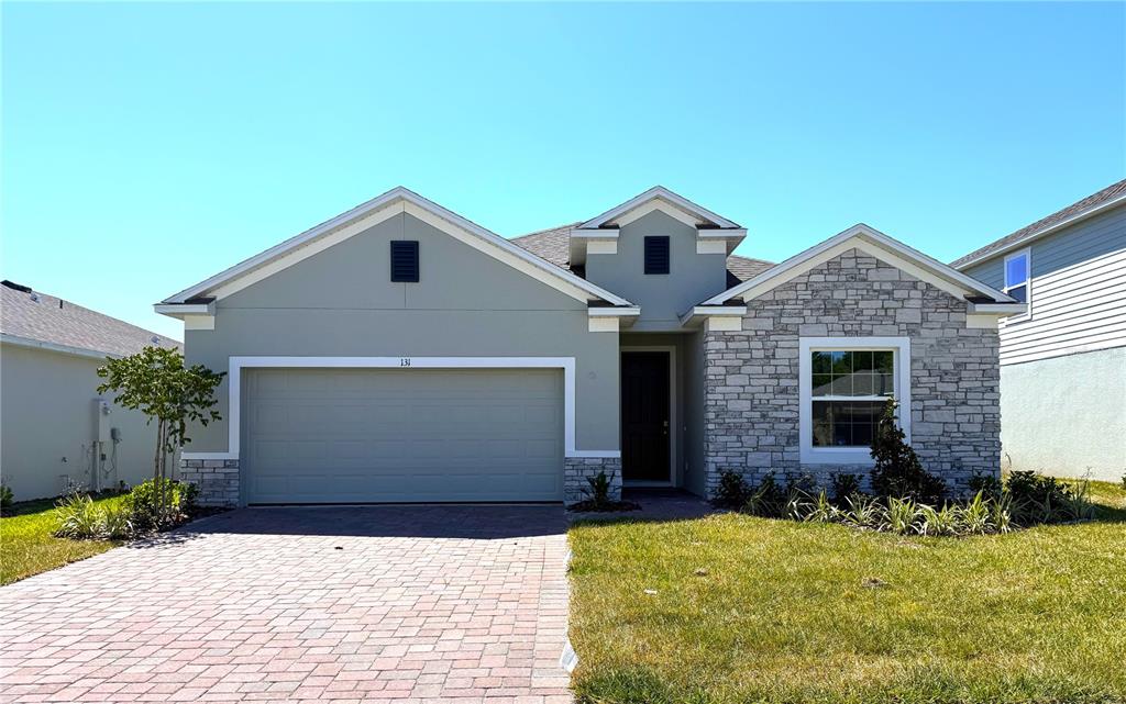 131 Saddle Hill Road DeLand, FL 32720 - Photo 1 of 1 a front view of a house with a yard
