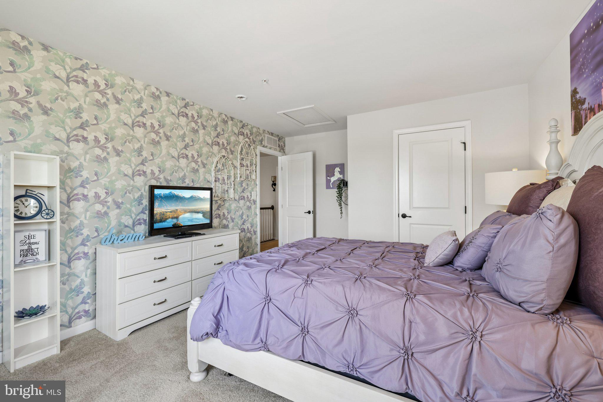 507 Potomac Road Joppa, MD 21085 - Photo 38 of 66 a bedroom with a bed and a flat screen tv