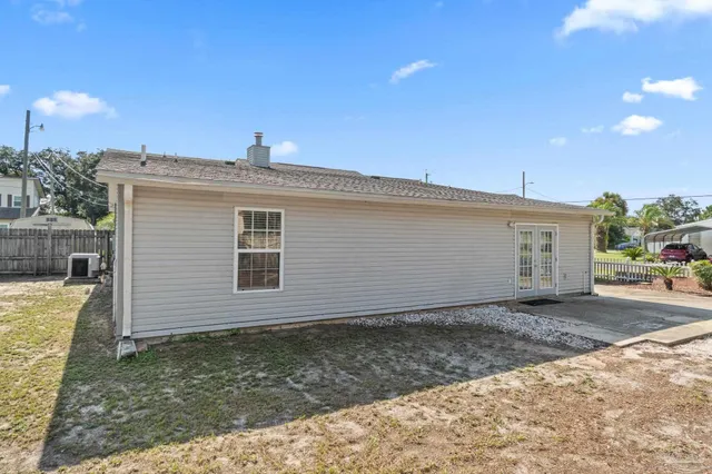 a house view with a backyard space