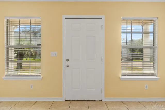 a view of an empty room with windows