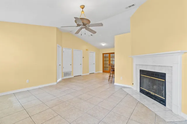 a view of an empty room with a fireplace