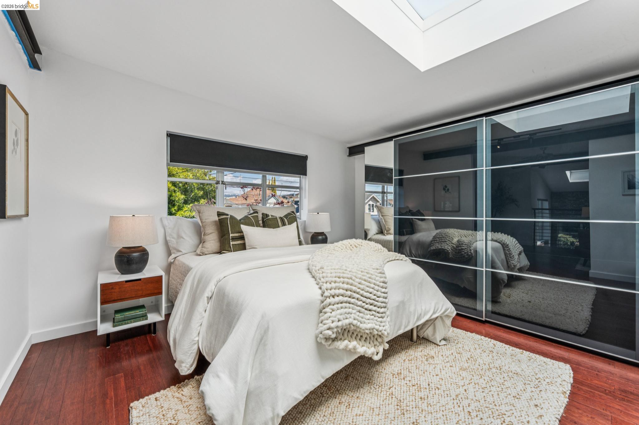 829 21st Street, Unit 1 Oakland, CA 94607 - Photo 28 of 46 a bedroom with a bed and a window