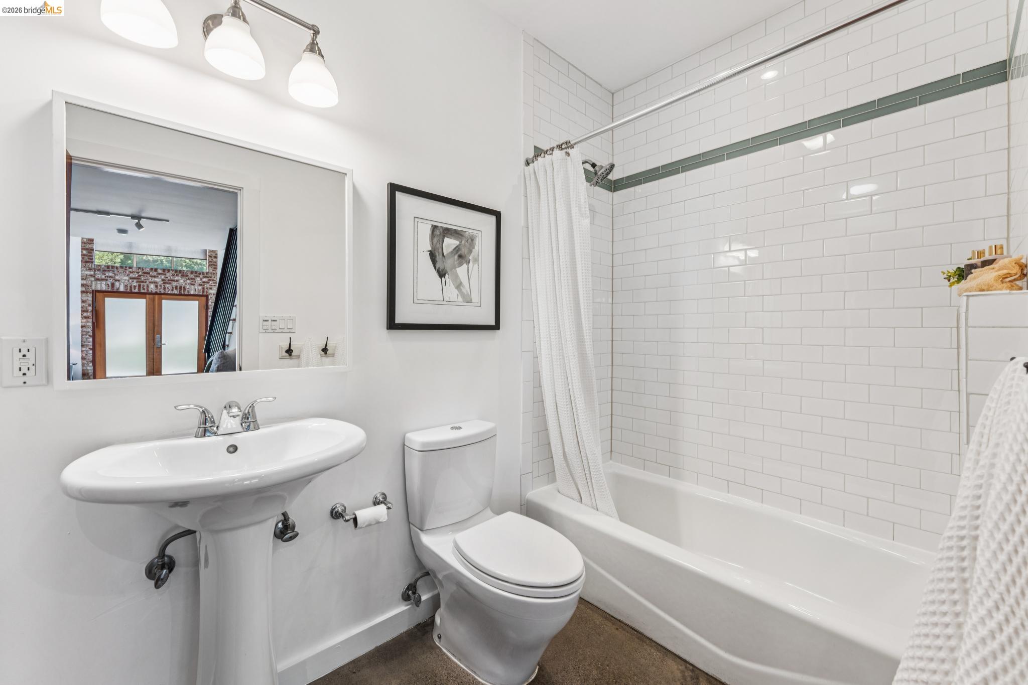 829 21st Street, Unit 1 Oakland, CA 94607 - Photo 33 of 46 a bathroom with a sink toilet and shower