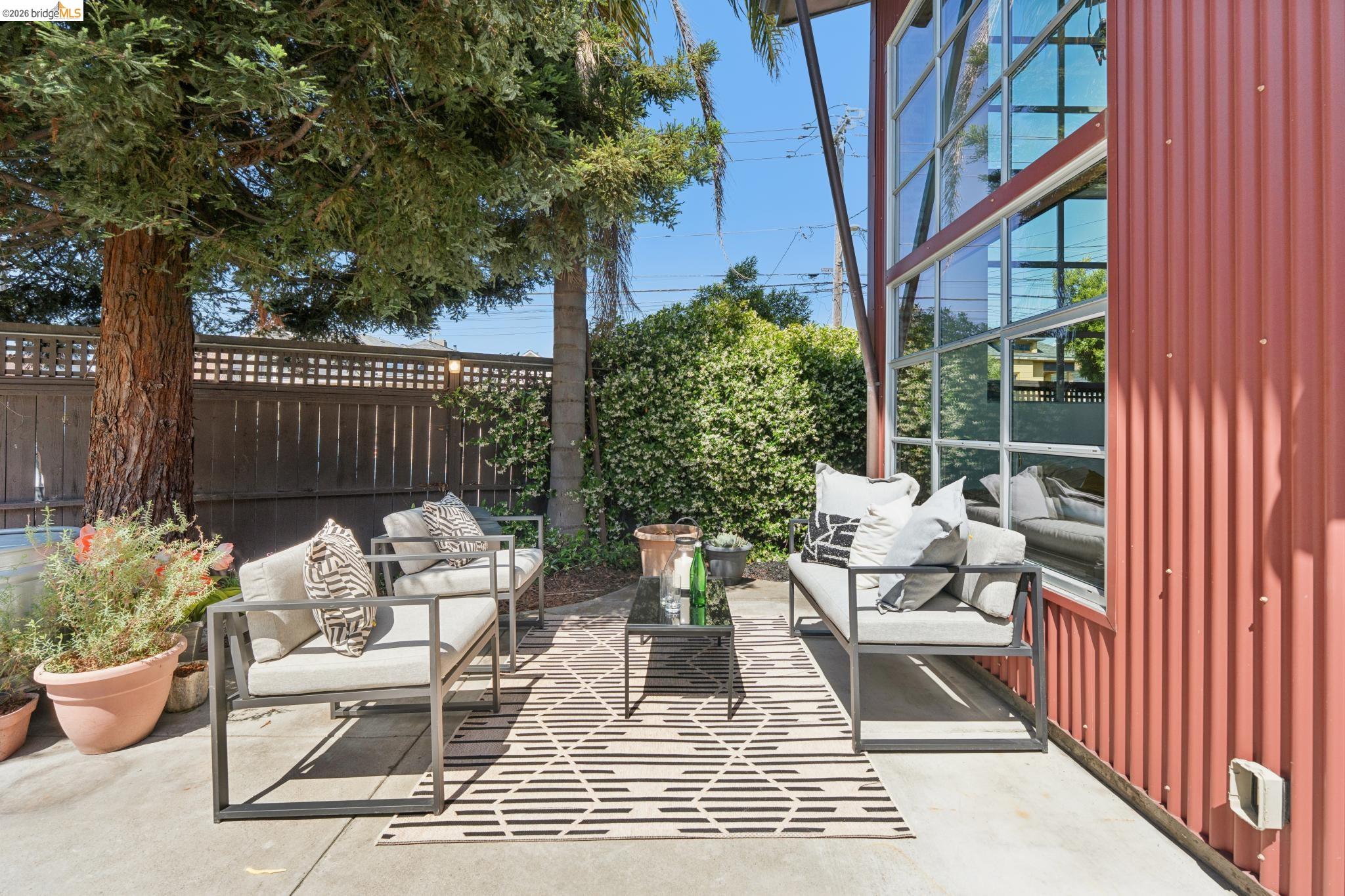 829 21st Street, Unit 1 Oakland, CA 94607 - Photo 40 of 46 a view of a patio with couches and potted plants