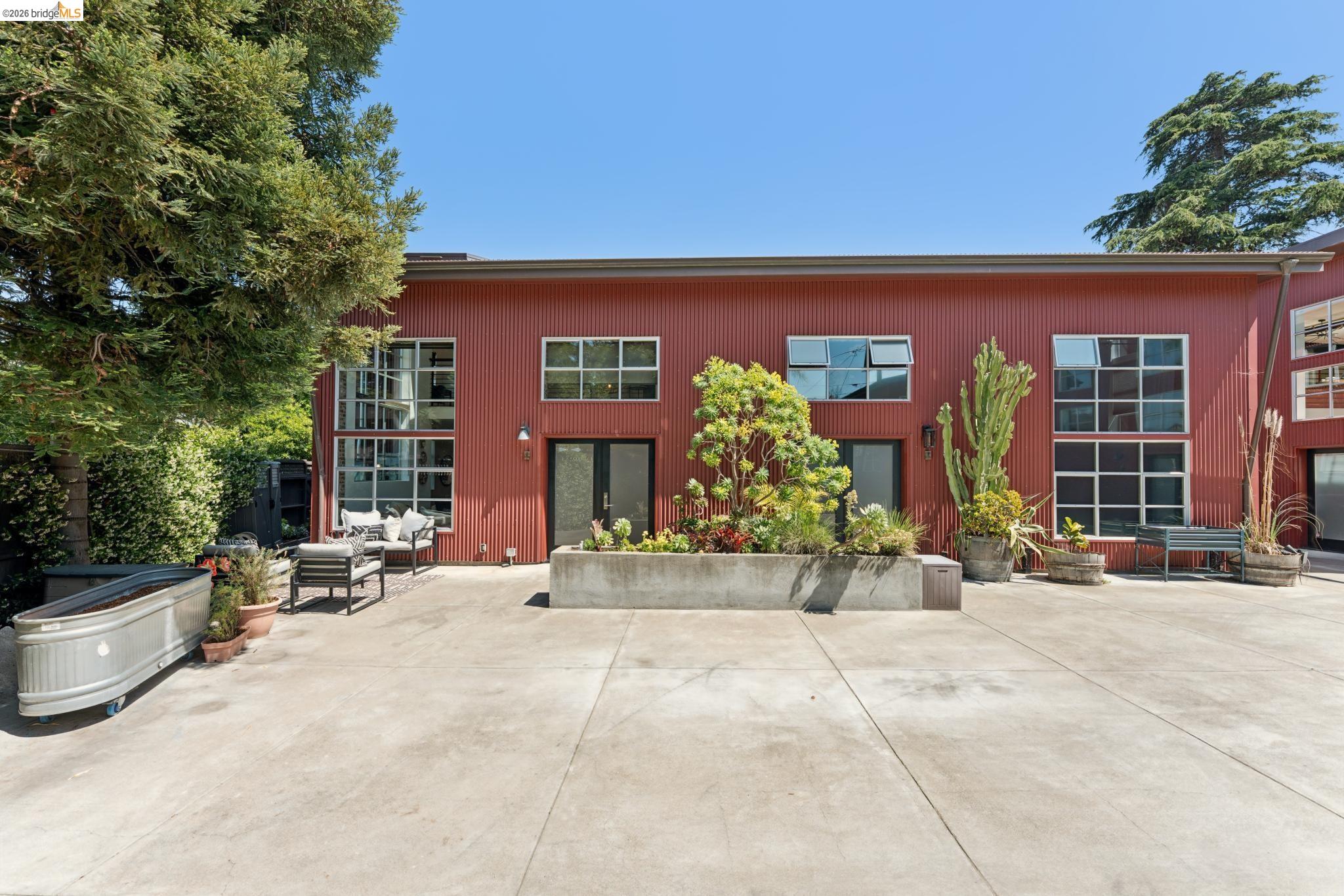 829 21st Street, Unit 1 Oakland, CA 94607 - Photo 41 of 46 front view of a house with a patio