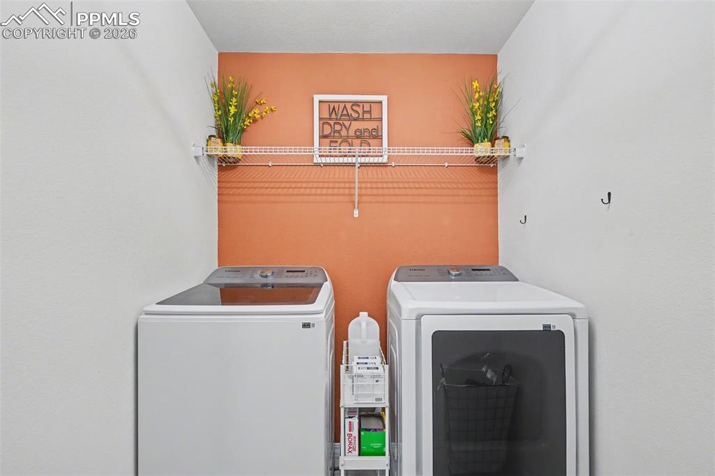 7811 Berwyn Loop Peyton, CO 80831 - Photo 18 of 38 a utility room with dryer and washer