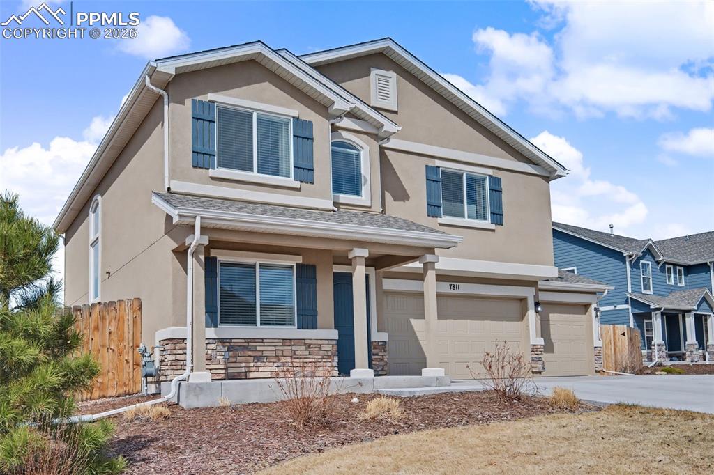 7811 Berwyn Loop Peyton, CO 80831 - Photo 2 of 38 a front view of a house with a yard